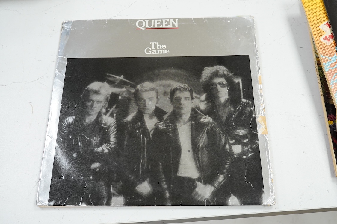 Fourteen LP record albums including eleven The Beatles and related; Sgt. Pepper’s Lonely Hearts Club Band (plus an additional three others), The Beatles at the Hollywood Bowl, Magical Mystery Tour, Revolver, etc., plus t